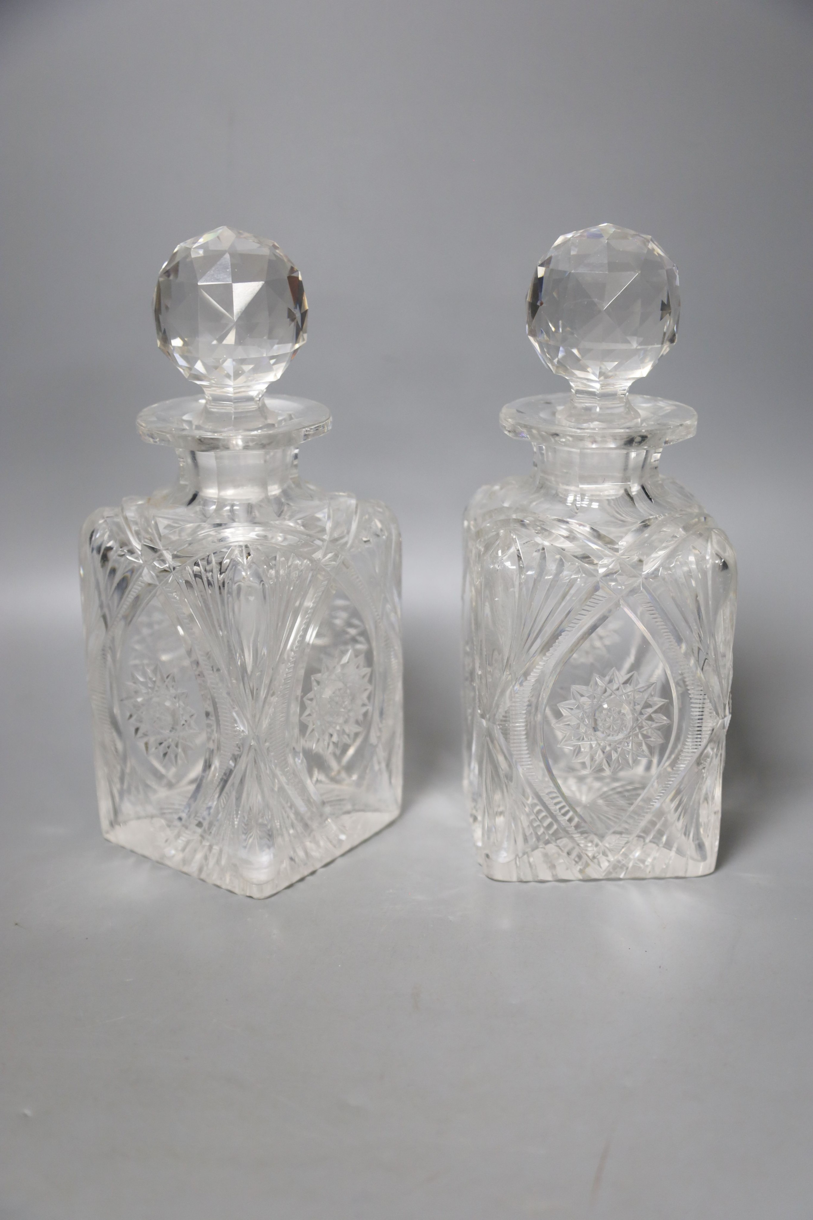 A pair of whisky case decanters and a pair of Victorian decanters 27cm